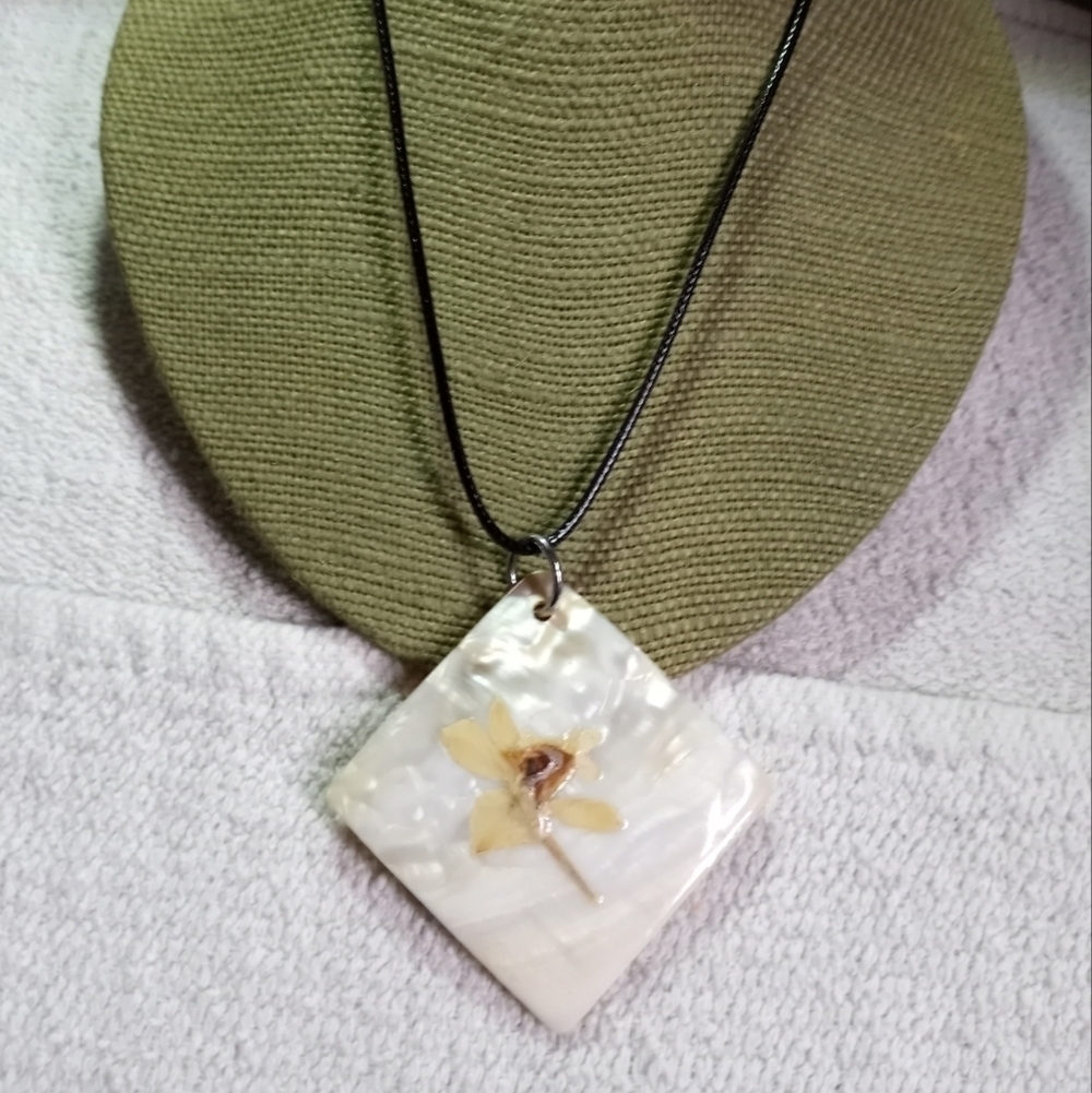 Large shell pendant with painted flower 🌸 on black cord necklace